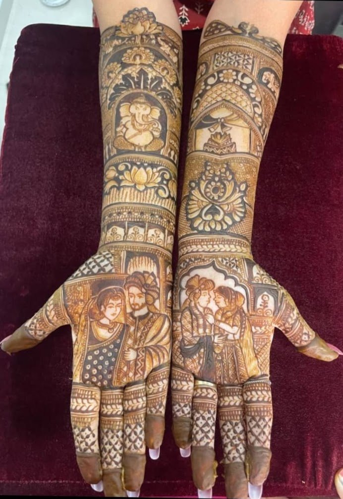 Full-hand bridal mehndi with Ganesha, lotus and bride-groom figures – Chaitali's Mehndi Art