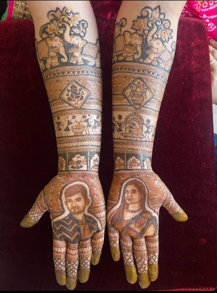 Portrait bridal mehndi with couple faces, elephants and Warli art – Chaitali's Mehndi Art